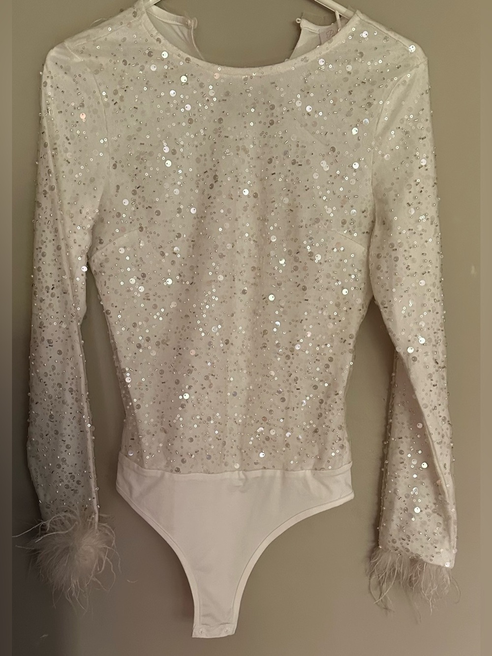 PINK LILY size SMALL WHITE Sequin with Feather Trim Long Sleeves Bodysuit